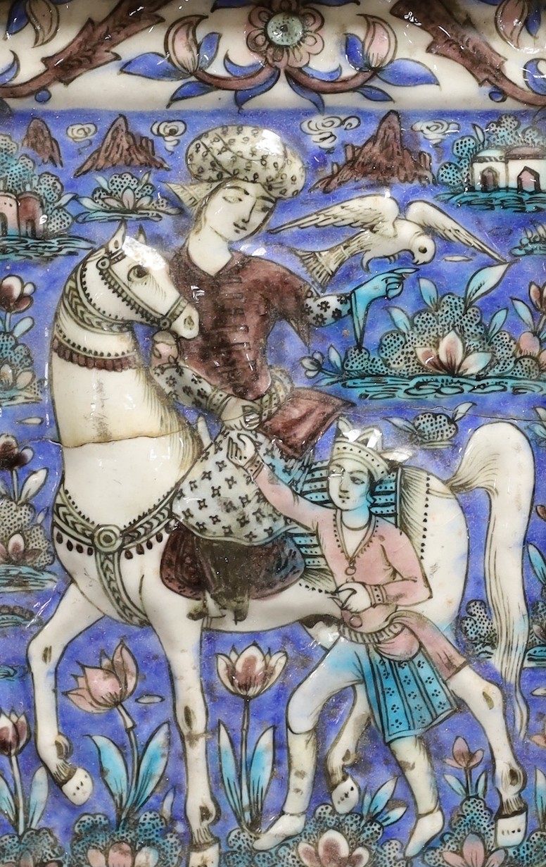 A framed 19th century Persian polychrome tile, Qajar dynasty, 25x16cm